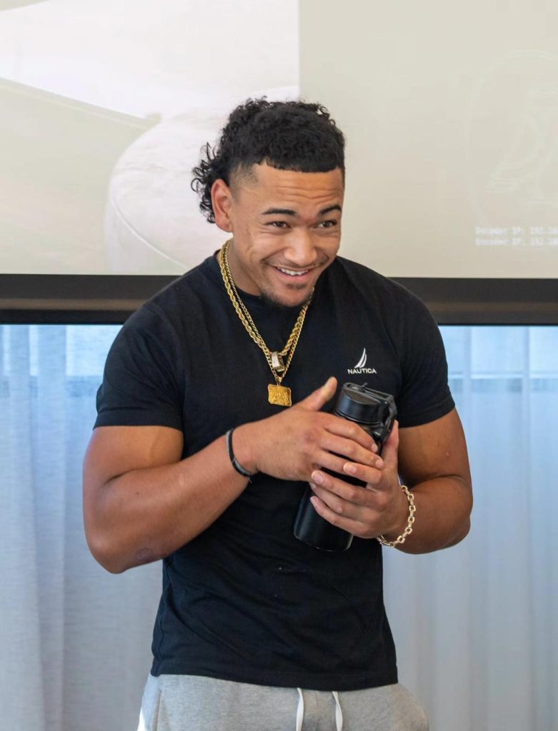 Aitu player smiling in camp