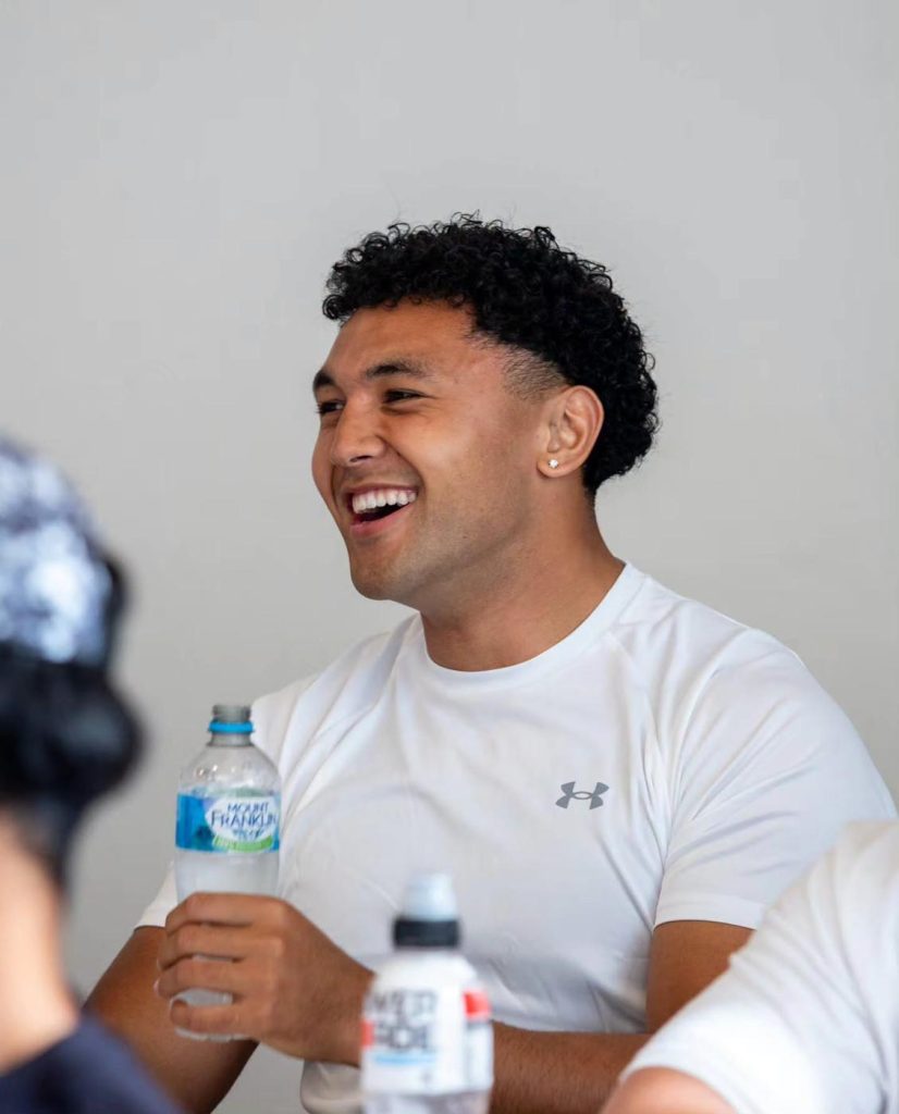 Aitu player laughing in camp